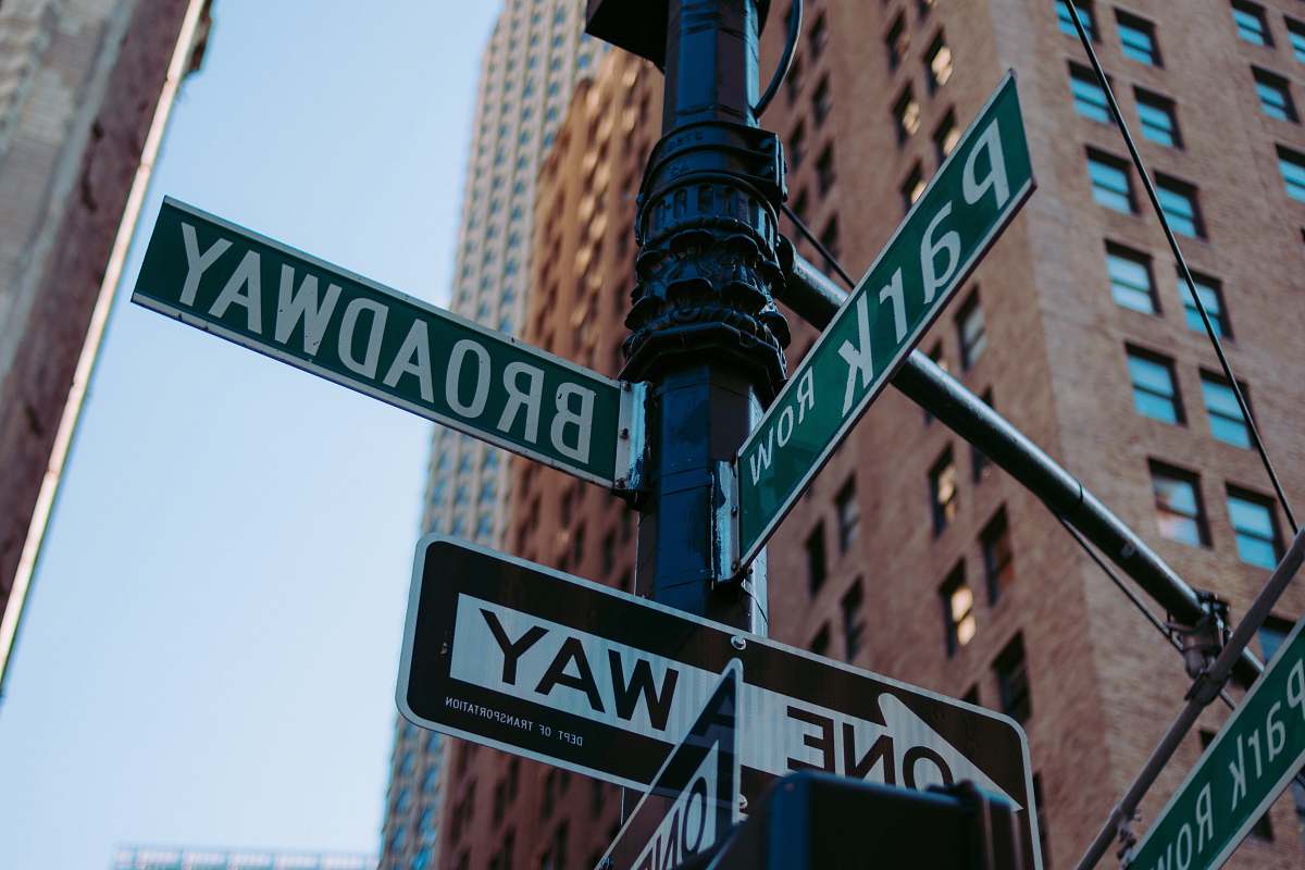 symbol low-angle photography of street signage road sign